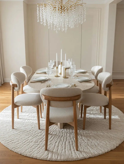 Table à manger ovale en travertin avec chaises bouclette Modernista Maroc