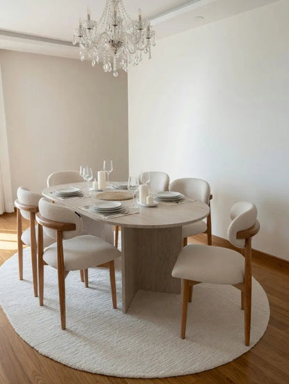 Table à manger ovale en travertin avec chaises bouclette - Modernista Maroc